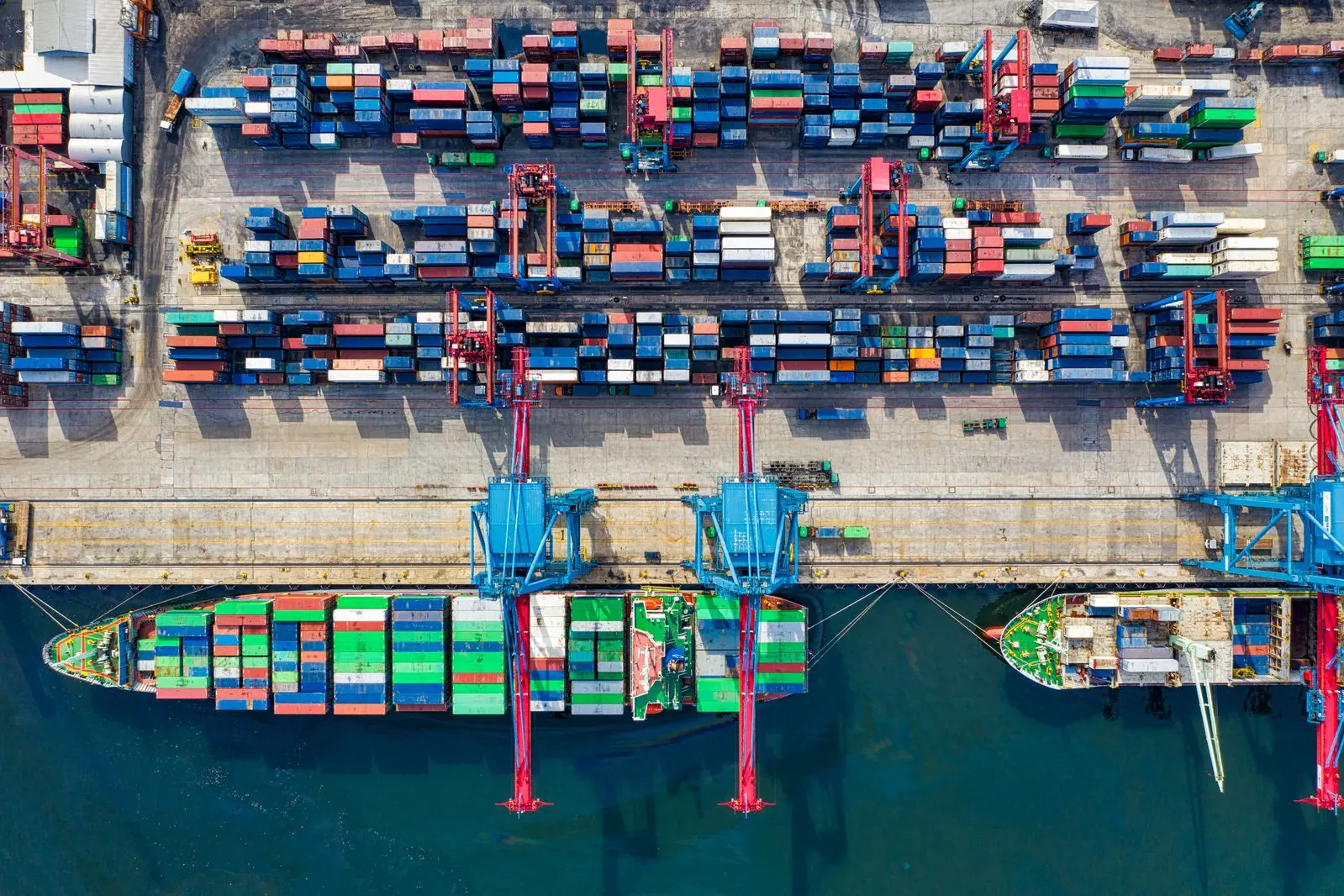 Container port at dusk — the destination of consolidated shipments
